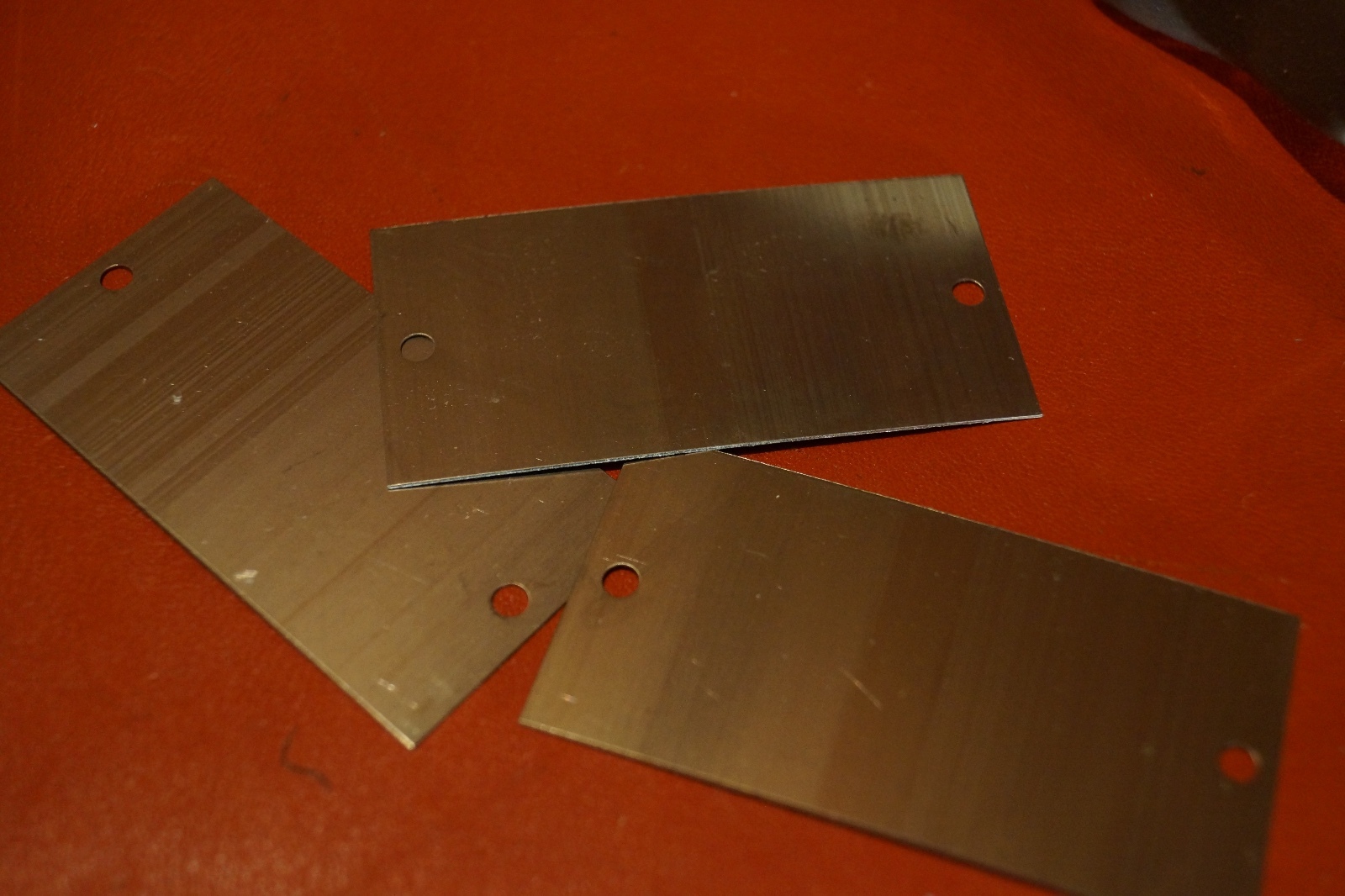 One new 1.5″ x 3.0″ x .015 Titanium tag with two 5/32 holes.
